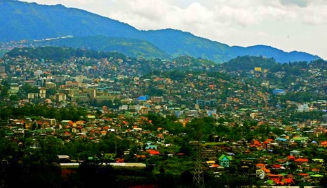 BAGUIO AT 104. Baguio, which has a land area of 57 square-kilometers and designed for 25,000 people, is now home to close to 400,000 people and has grown to become one of the highly urbanized cities in the country. Baguio celebrates its 104th Charter Day anniversary on September 1. 010913_baguio_05_comanda.jpg.

