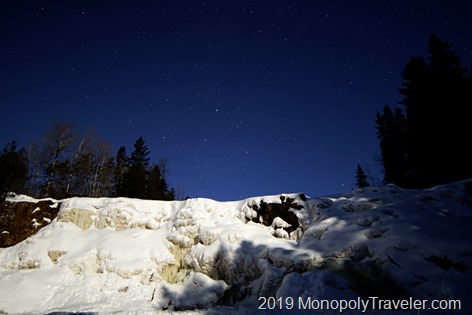 Frozen Gooseberry Falls lit up by the full moon