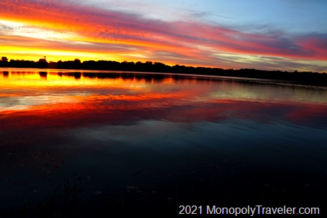 Beautiful sunrise coloras reflecting off of a calm lake