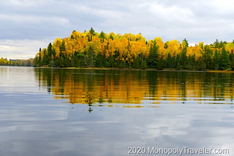 Beautiful fall trees reflecting in a calm lake