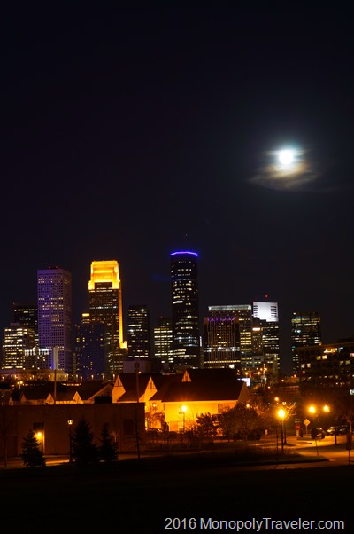 Minneapolis with the moon rising behind it
