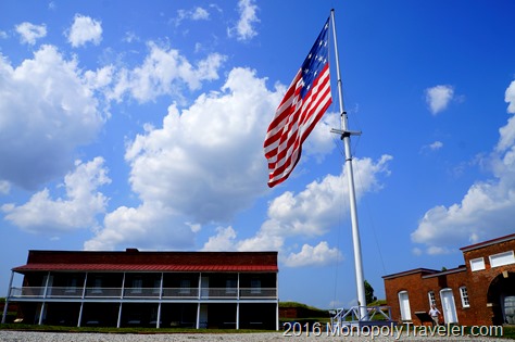 A huge American flag flying in the courtyard