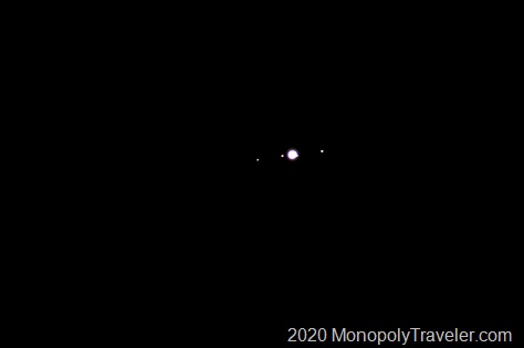 Jupiter with four of its moons